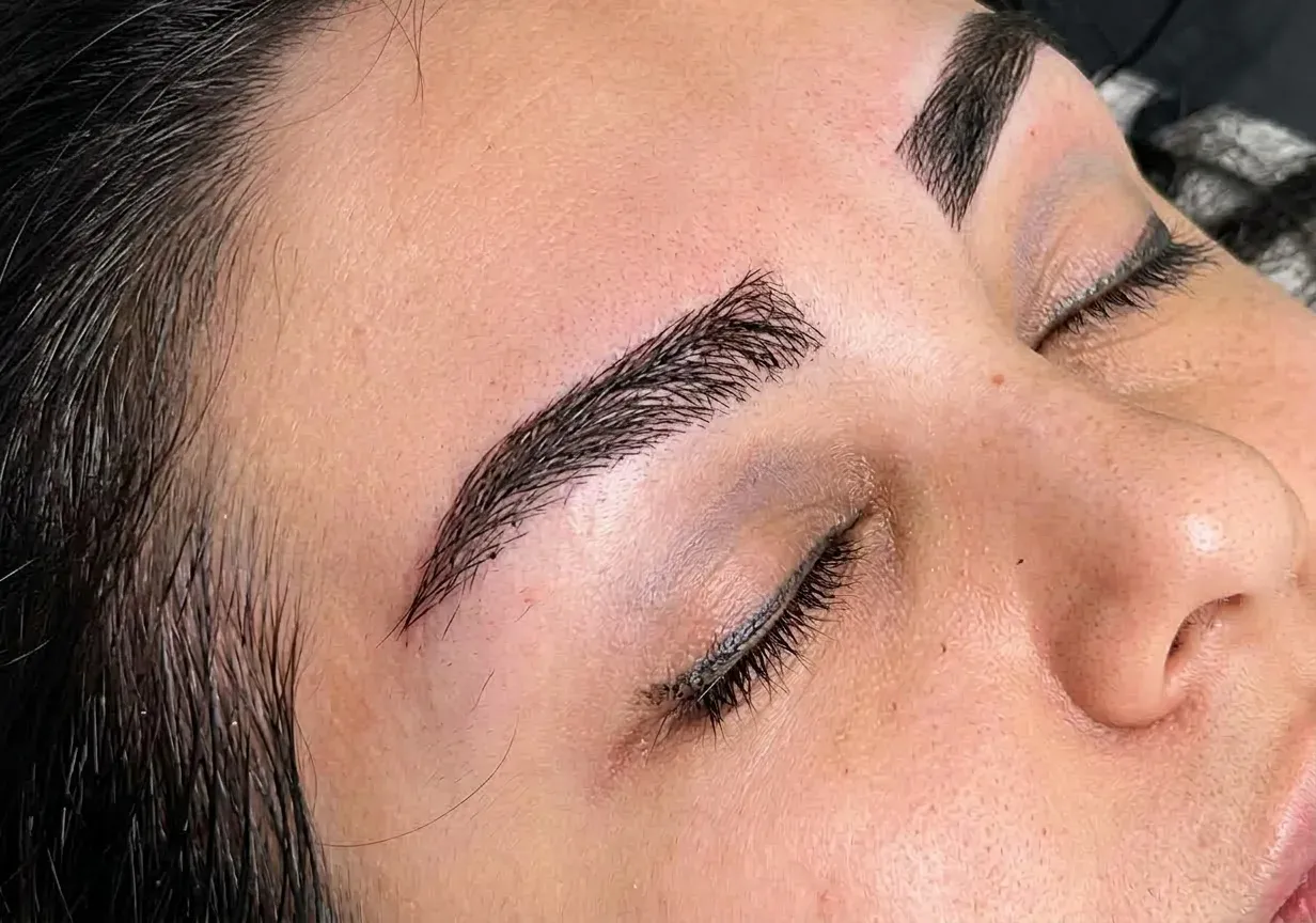 Macro close-up showing natural single-hair eyebrow growth and direction